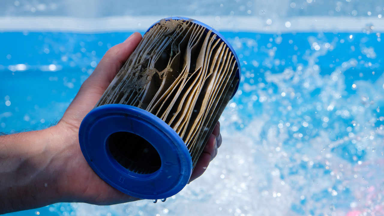 A dirty pleated media cartridge filter 