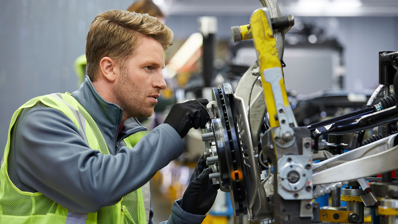 Auto worker in a manufacturing facility where liquid bag filters are used to handle specialized high volume water filtration
