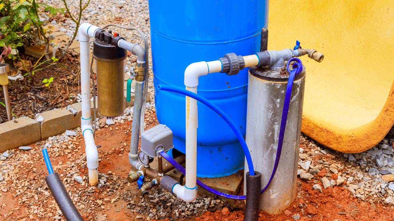 A home drilled well with pressure tank, shut off valve, and sediment filter