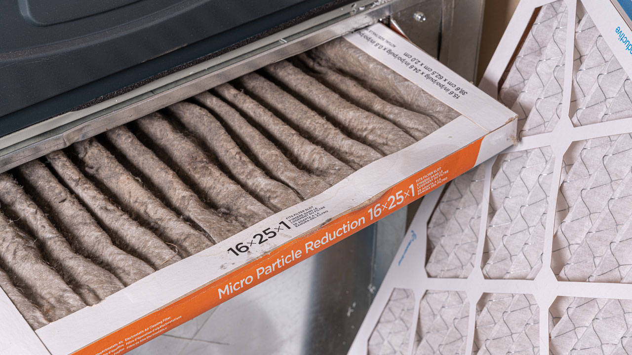 A dirty 16x25x1 air filter and a clean replacement filter