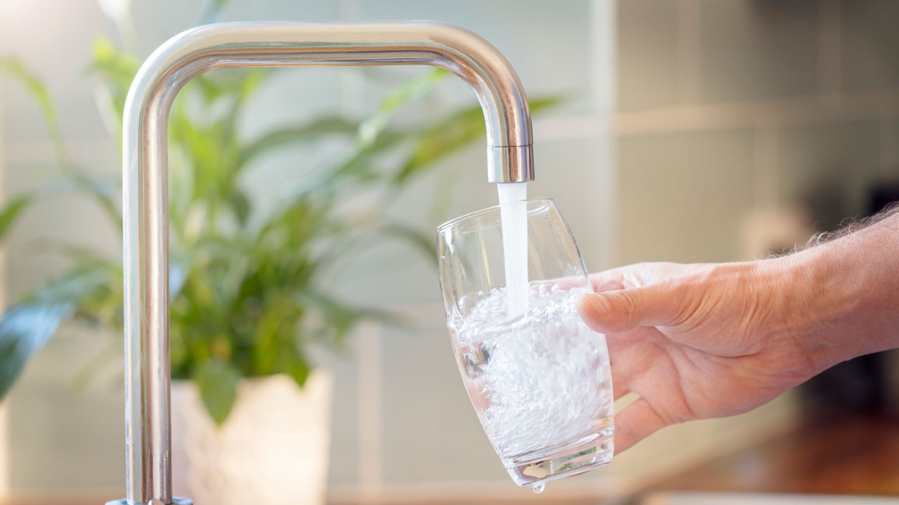 Clean water flowing at a good rate from a kitchen faucet
