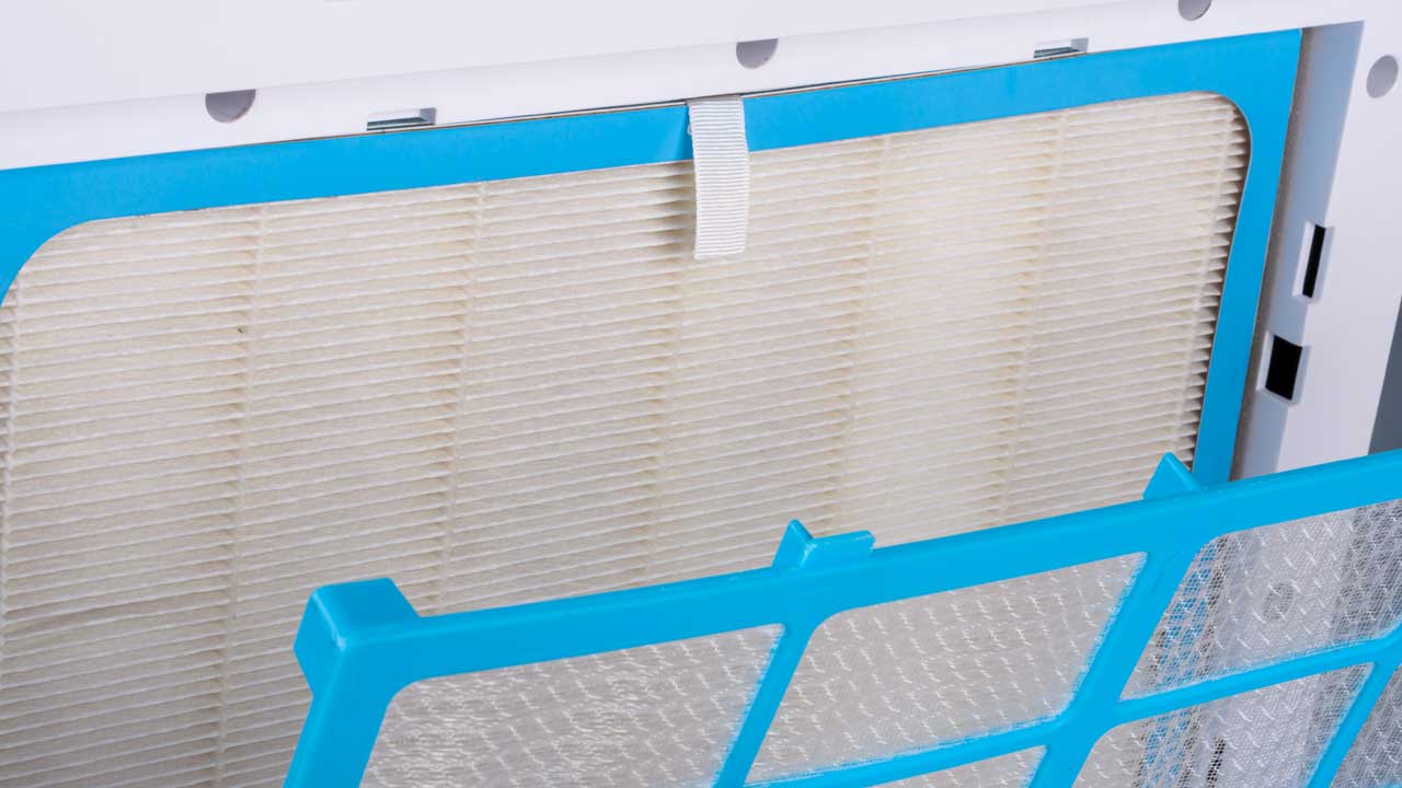 A HEPA-style filter inside of a stand-alone air purifier unit