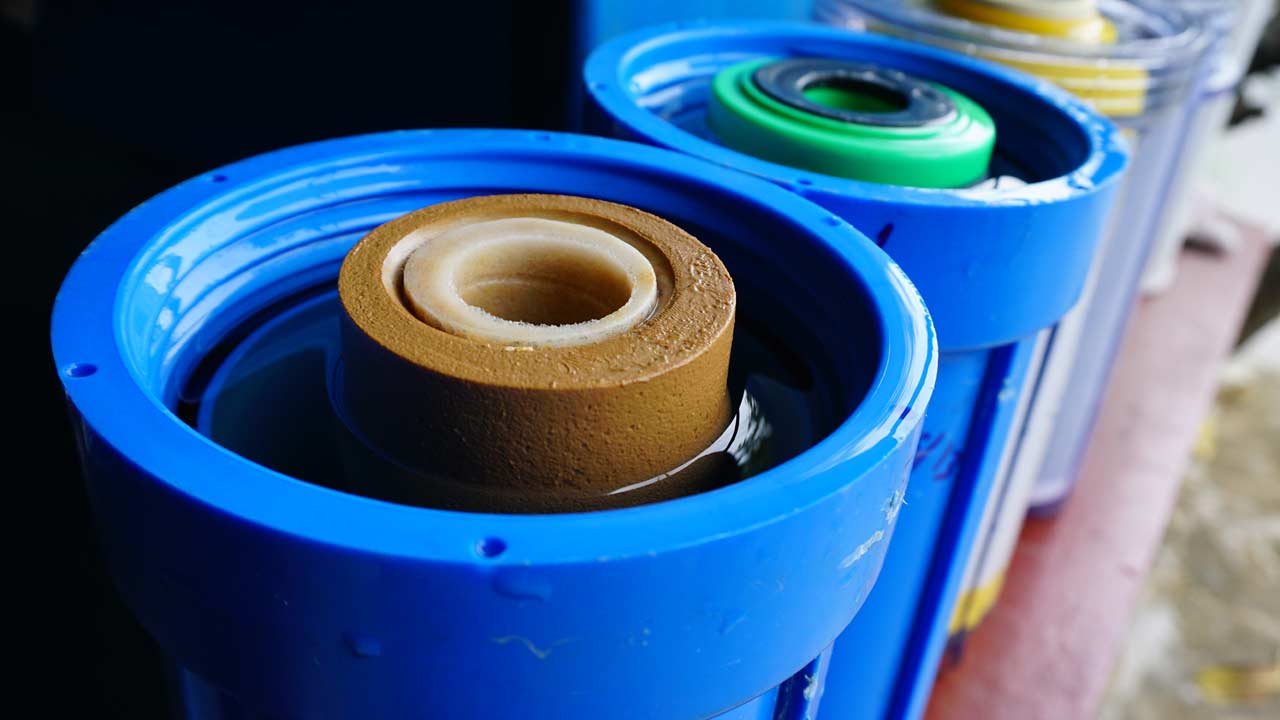 Blue water filter housing and used water filters
