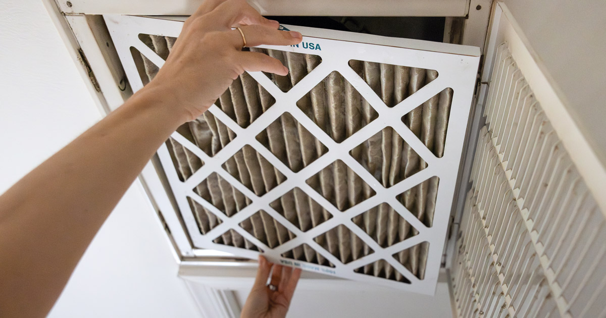 Replacing a dirty 1" filter in a ceiling-mounted HVAC panel