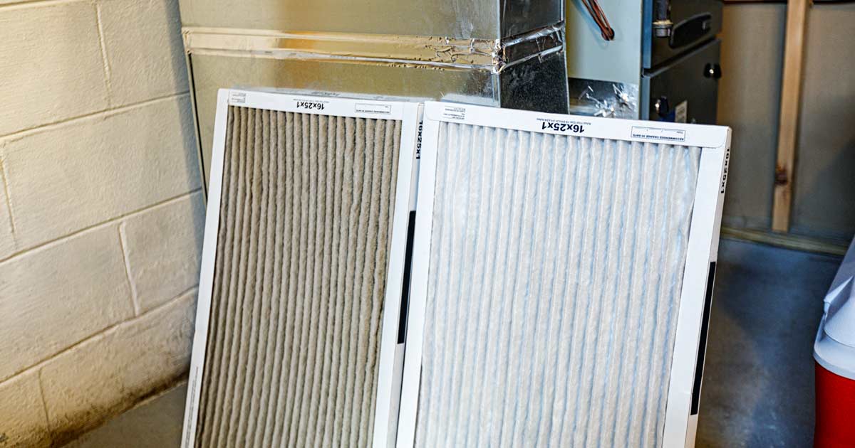 A clean, bright white pleated filter on the right. A grey, dirty, clogged old filter on the left.