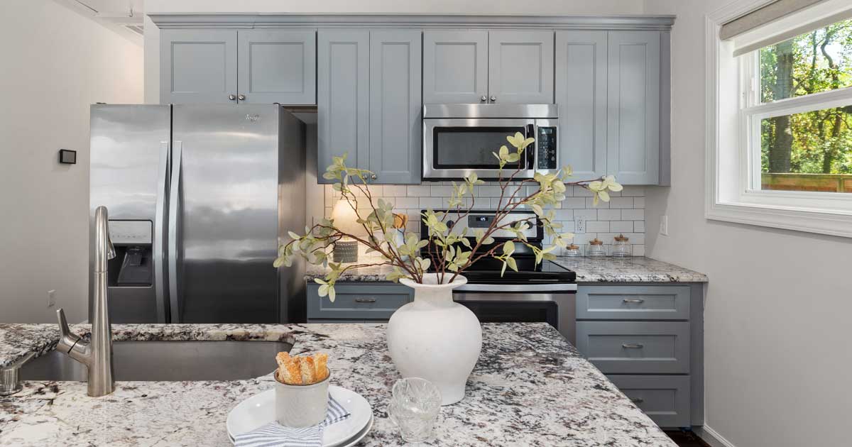 Tidy modern kitchen with Whirlpool refrigerator and water and ice dispenser Pexels image Curtis Adams
